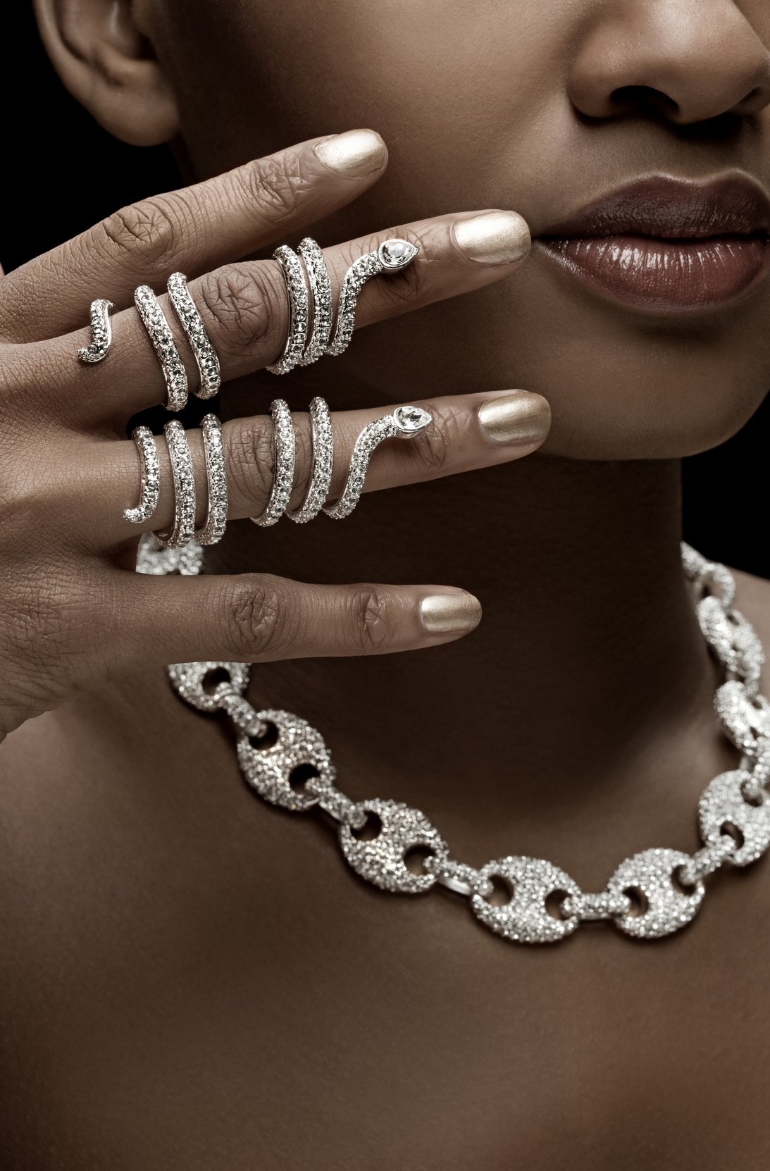 close up of black woman wearing luxury silver jewellery